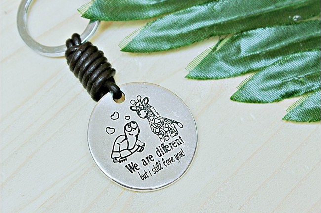 Llavero we are different but i still...