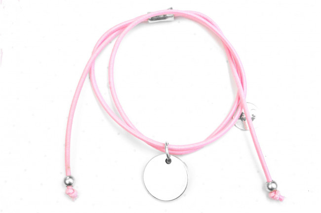 Pulsera elástica y medalla