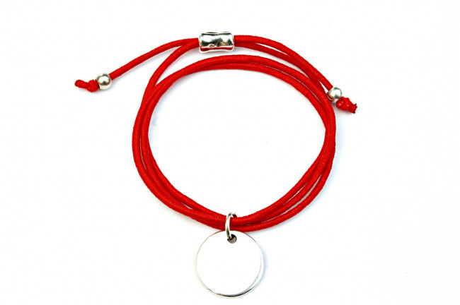 Pulsera elástica y medalla